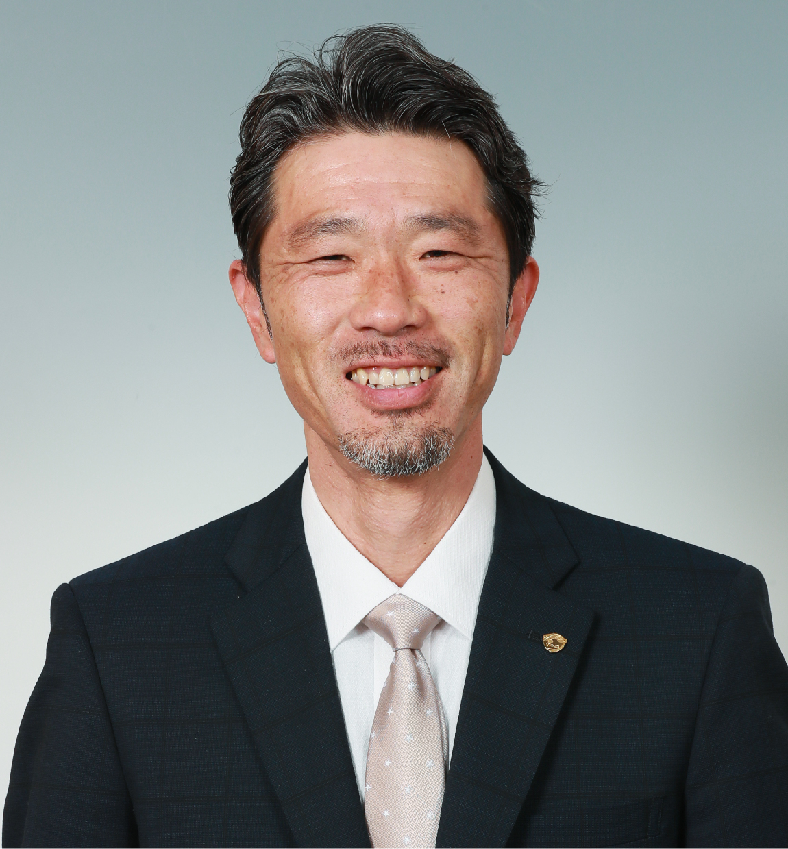 強化育成本部長 丹治 祥庸の写真を紹介